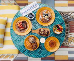 breakfast items including pastries, yogurt and fruit, banana bread